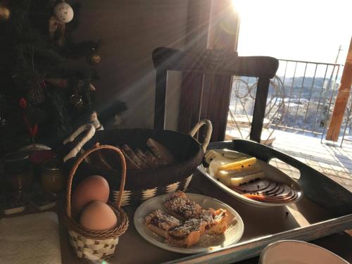 a tray with eggs and other food on a table at Hotel Papanikola in Piána