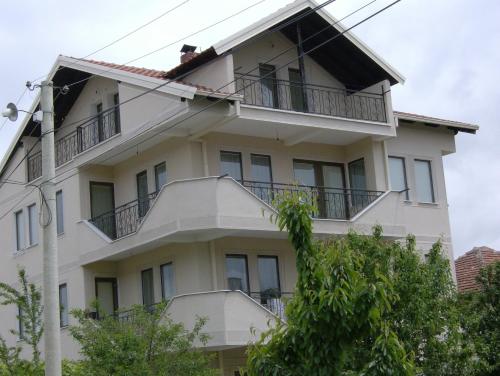 a large white building with balconies on it at Residence Krstanoski in Ohrid