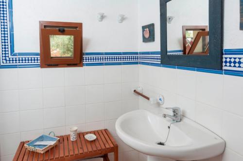 a bathroom with a sink and a mirror at Can Corro in Alcudia