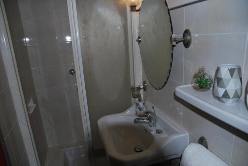 a bathroom with a toilet and a sink and a mirror at cal erre in Céret