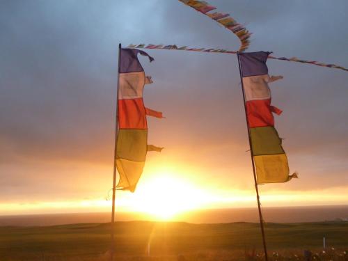 two flags in front of the sunset at Longbeach- Adults Only in Newquay