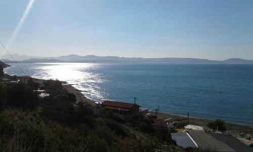a view of a beach and the ocean at Studio Galatia, in the heart of Kamilari in Kamilari