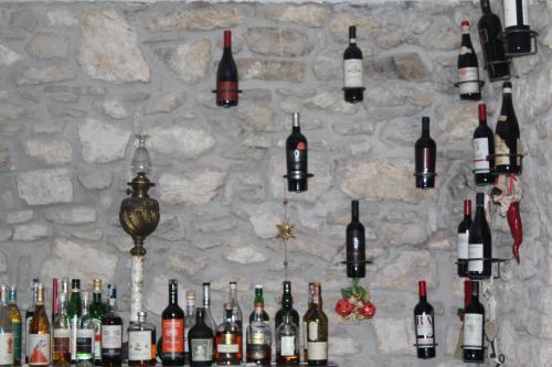 a wall filled with lots of bottles of wine at Villa Augusta in Civitanova del Sannio