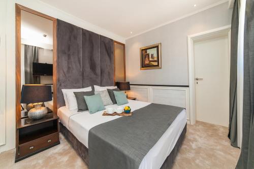 מיטה או מיטות בחדר ב-Hotel Casa del Mare - Amfora