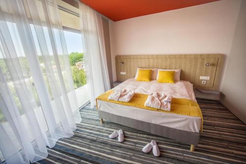 Ένα ή περισσότερα κρεβάτια σε δωμάτιο στο Park Inn by Radisson Zalakaros Hotel & Spa - All inclusive