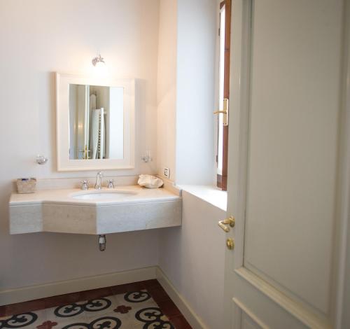 a bathroom with a sink and a mirror at Castello Di Mornico Losana in Mornico Losana