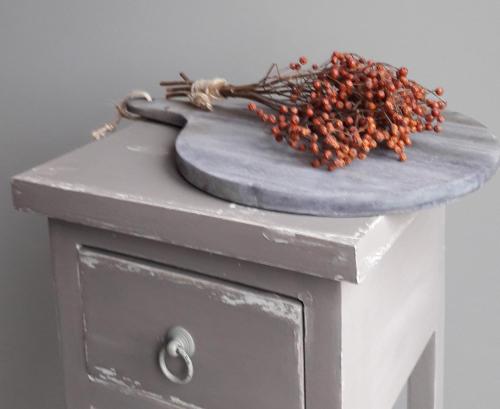 a grey table with a bunch of berries on it at Hoeve Schevey in Mechelen