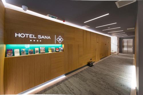 a hotel samax sign on a wall in a hallway at Hotel Sana in Sarajevo