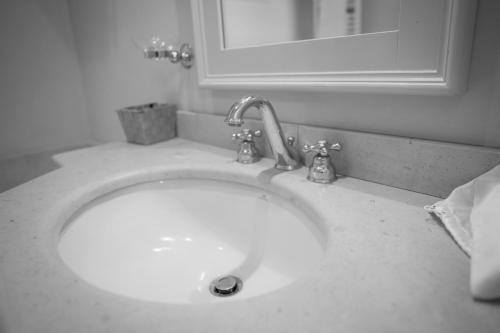 a sink with a faucet in a bathroom at Castello Di Mornico Losana in Mornico Losana