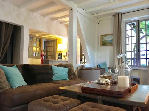 a living room with a couch and a coffee table at Coeur des Neiges in Saint-Gervais-les-Bains