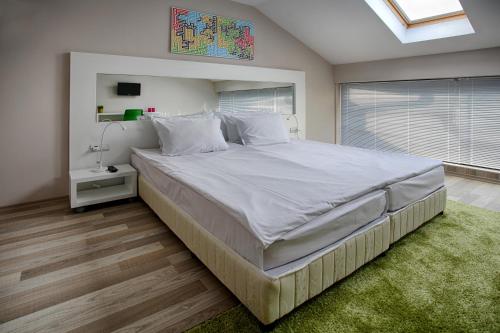 Ένα ή περισσότερα κρεβάτια σε δωμάτιο στο Executive Rooms and Suites Play