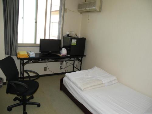 Televisyen dan/atau pusat hiburan di Business Hotel Minshuku Minato