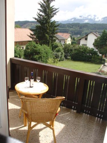 a table and chairs on a balcony with a view at Pension Katharina Frühstück ab 5 Uhr früh in Seeboden