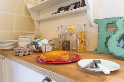 a table with a plate of food on a counter at Masseria Sorani in Manduria