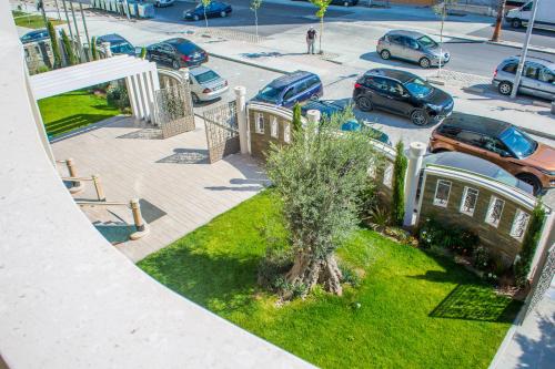 an aerial view of a parking lot with cars parked at Hotel Vila Koral in Durrës