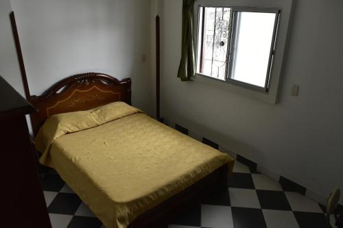 Uma cama ou camas num quarto em Hotel El Principe
