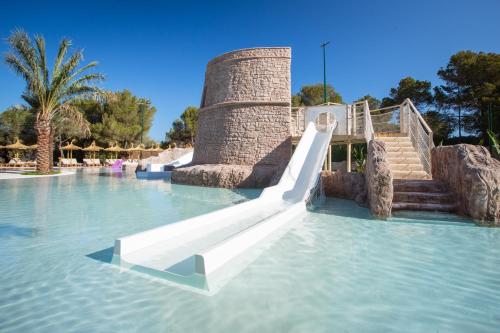 a slide in the water at a water park at Insotel Club Maryland in Playa Migjorn