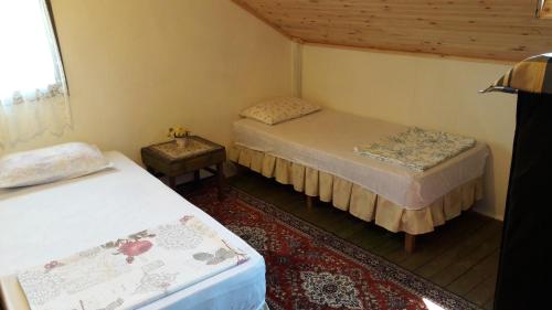 Un pat sau paturi într-o cameră la Robinson Stonehouse