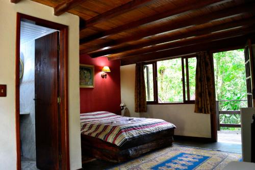 Säng eller sängar i ett rum på Spa e Hotel Fazenda Gaura Mandir