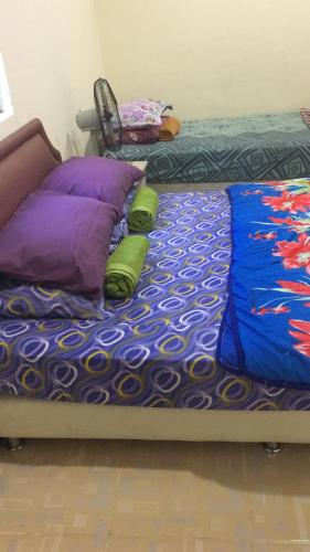 Katil atau katil-katil dalam bilik di Homestay d SOFIA