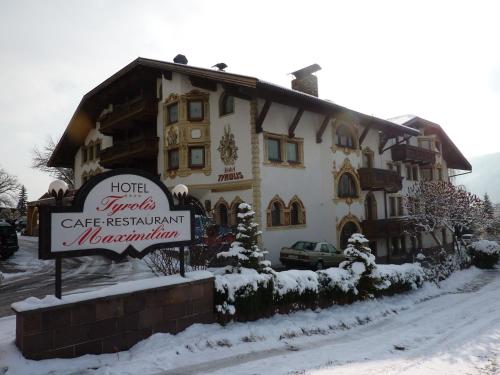 a hotel with a sign in front of a building at Hotel Tyrolis in Zirl