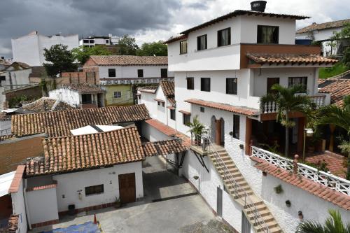 an aerial view of a white building with red tile roofs at Hotel El Principe Sede Campestre in Ocaña