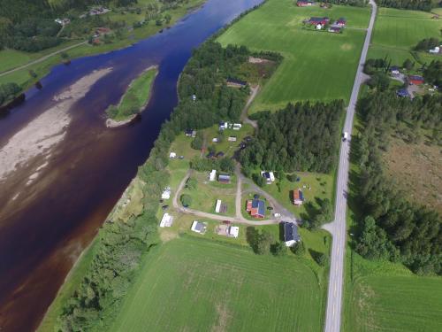 an aerial view of a farm next to a river at Holmset Camping and Fishing in Namdalseid