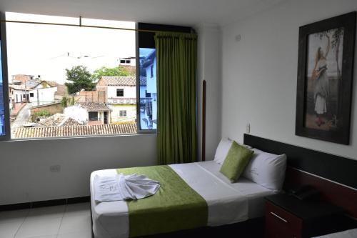 Katil atau katil-katil dalam bilik di Hotel El Principe Sede Campestre