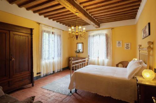 מיטה או מיטות בחדר ב-Villa di Papiano