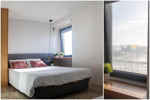 a bedroom with a bed and a window at Furabeach Alojamentos in Furadouro