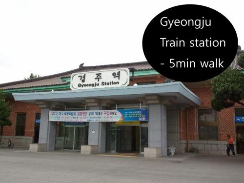 a building with a train station on top of it at Gyeongju Momojane Guesthouse in Gyeongju