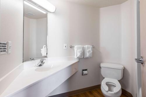 a white bathroom with a sink and a toilet at Motel 6-Cedar City, UT in Cedar City