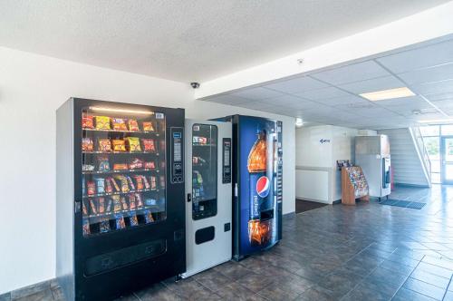 a vending machine in a building with drinks in it at Motel 6-Oklahoma City, OK - South in Oklahoma City