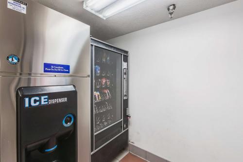 a ice machine in a room with a wall at Motel 6 Omaha - Central in La Vista