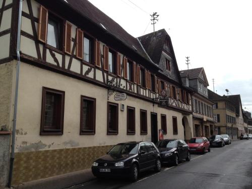 a row of cars parked in front of a building at Bed and Breakfast - Rheingauer Hof in Oestrich-Winkel