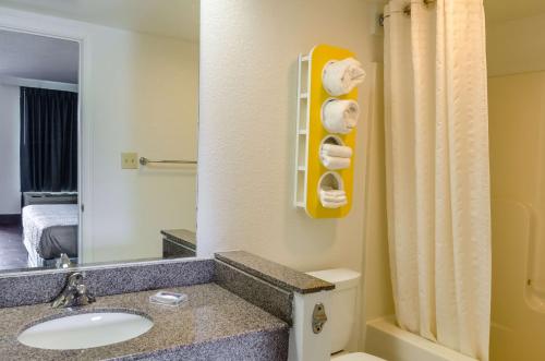 a bathroom with a sink and a toilet and a mirror at Motel 6-Lexington, VA in Lexington