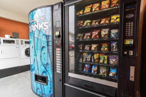 a vending machine with a snowboard in front of it at Motel 6-Long Beach, CA - International City in Long Beach