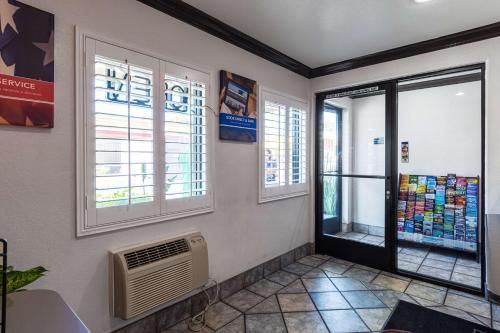 a room with a window and an air conditioner at Motel 6 Riverside, CA - UCR East in Riverside
