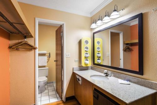 a bathroom with a sink and a mirror at Motel 6-Libertyville, IL in Libertyville