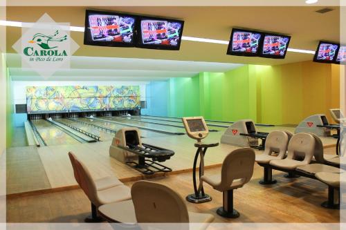 a bowling alley with bowling lanes and televisions at CAROLA in Pico de Loro in Nasugbu