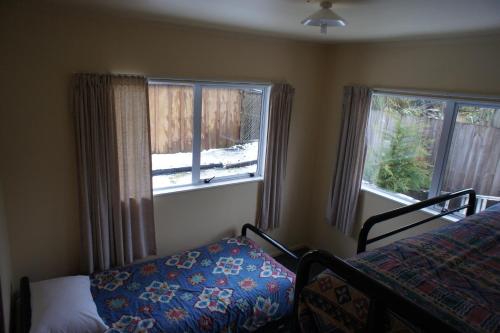 Un pat sau paturi într-o cameră la Holiday Chalet