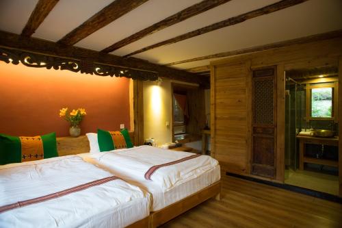 Courtyard Shangri-la 藏舍小院にあるベッド