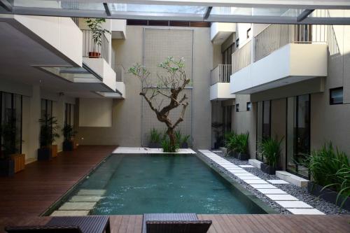 a swimming pool in the middle of a building at M Pavilion - Lippo Karawaci in Tangerang