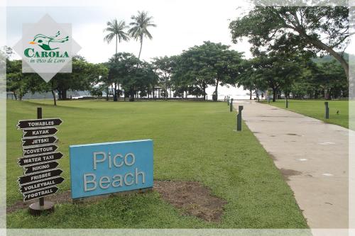 a sign in a park with a pizza beach at CAROLA in Pico de Loro in Nasugbu