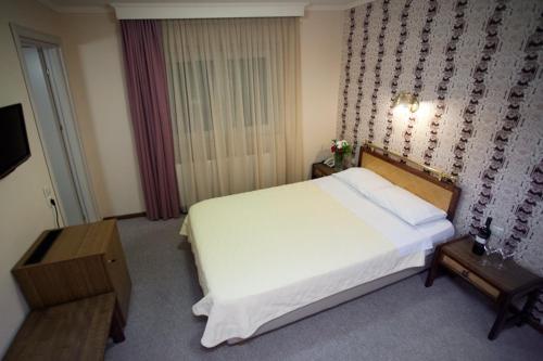 Katil atau katil-katil dalam bilik di Olympos Hotel