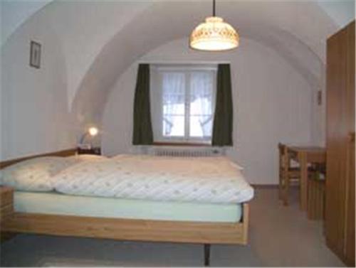 
Ein Bett oder Betten in einem Zimmer der Unterkunft Landgasthof St. Luzisteig
