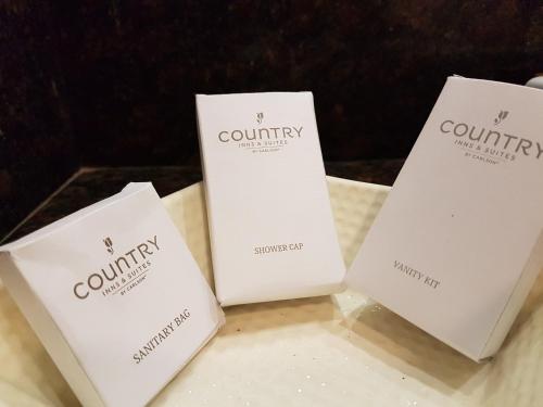 three white boxes sitting on top of a table at Country Inn & Suites by Radisson, Gurugram Sector 12 in Gurgaon