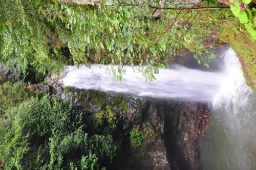 an aerial view of a waterfall on a river at Ayder Hasimoglu Hotel in Ayder Yaylasi