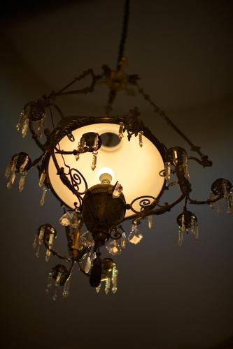 a chandelier is hanging from the ceiling at Baruch Guesthouse on Lovell in Stellenbosch