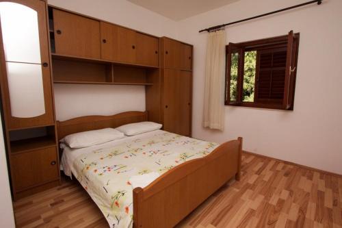 Postel nebo postele na pokoji v ubytování Apartments Stanko